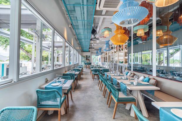 Bold and energetic restaurant design with striking patterns and vivid hues, created by Theodora Martinou of Irregular Lines.