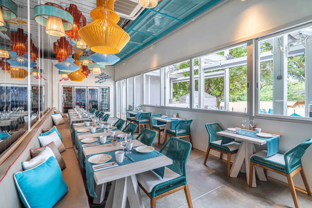 ibrant restaurant interior with bold colors and eclectic furniture design by Theodora Martinou from Irregular Lines