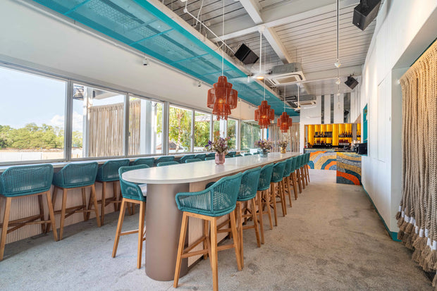 Eclectic restaurant featuring bold, contrasting colors and unique furniture pieces by Theodora Martinou of Irregular Lines